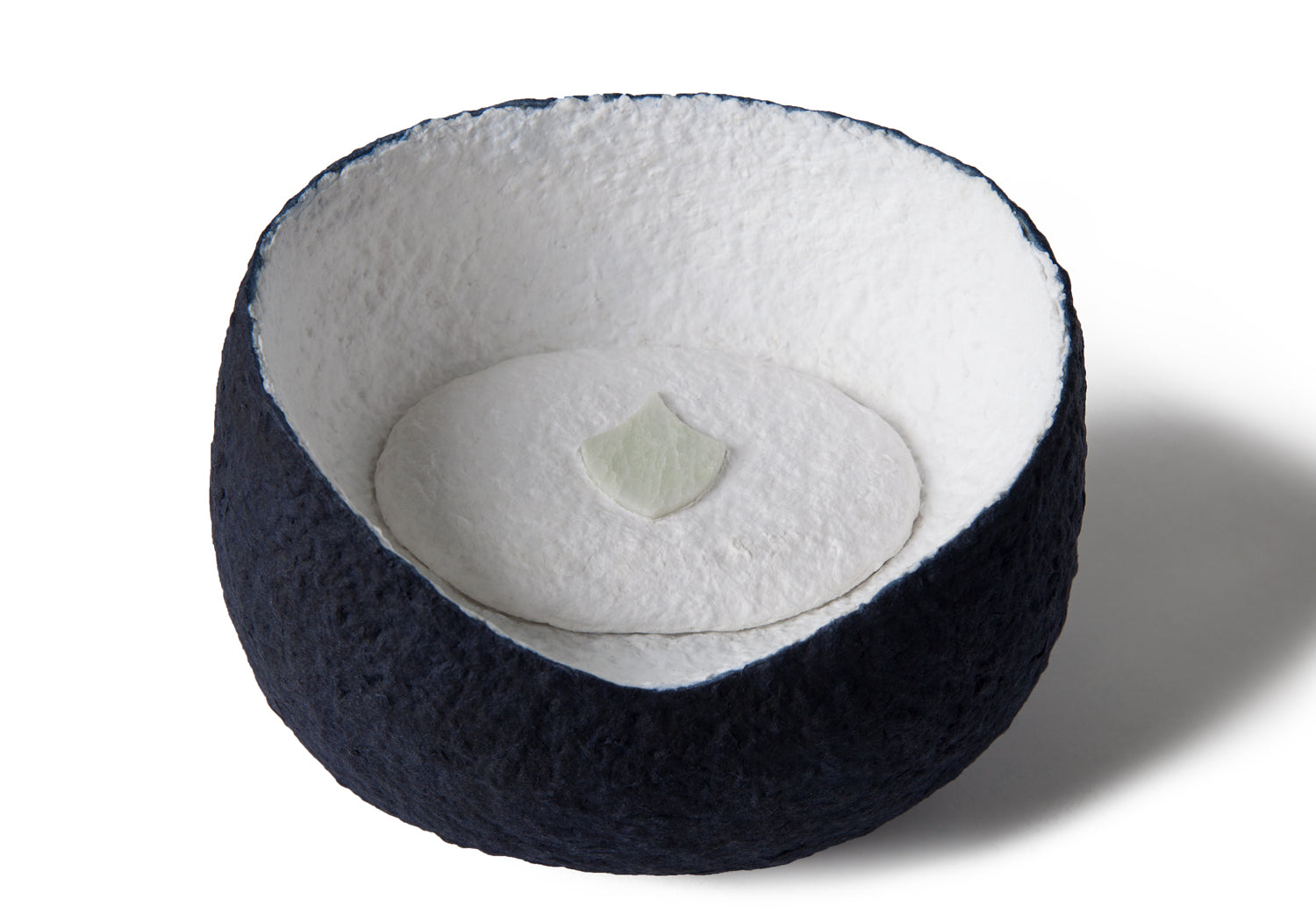 Picture of a white and blue ovoid shaped biodegradable cremation urn for pets on sale at Muses Design Urns. Top view.