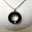 Picture of a Stainless Steel  cremation jewelry with a round pendant for ashes
